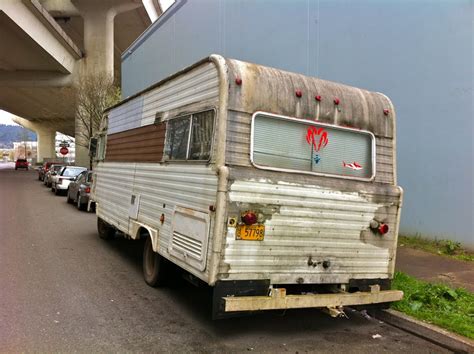 OLD PARKED CARS.: 1974 Champion RV, by Dodge.