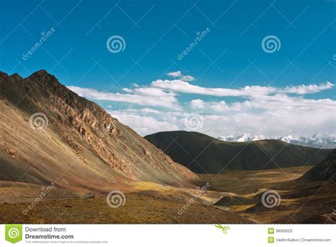 Harsh Landscape With Mountain Range And The Deep Blue Sky Stock Image
