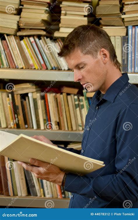 Young Man Reading A Book In The Library Stock Photo Image Of Person