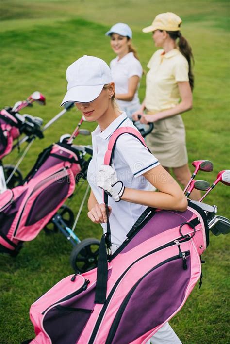 Selective Focus Of Women In Caps With Golf Equipment Stock Image