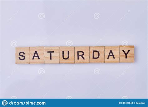 Saturday Word Made With Wooden Cubes And Black Letters Stock Photo