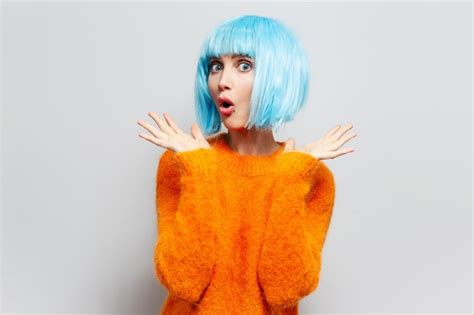 Premium Photo Studio Portrait Of Young Surprised Girl With Blue Hair