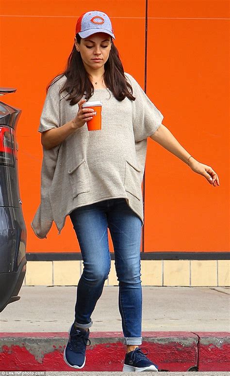 Mila Kunis Goes Casual Cool As She Covers Her Bump In Baggy Poncho On Solo Caffeine Run In La