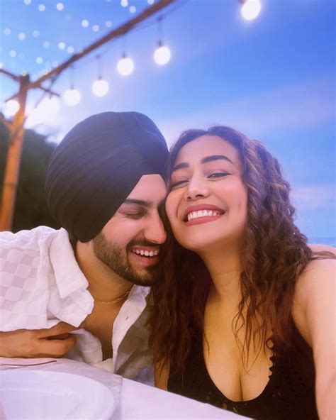 Neha Kakkar And Rohanpreet Singh Seal It With A Romantic Kiss Fans Get