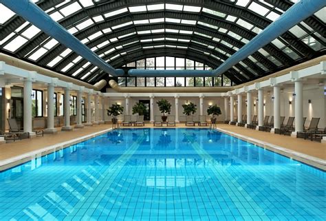 Stylish And Cool Indoor Swimming Pool Ideas With Black Wooden Structure