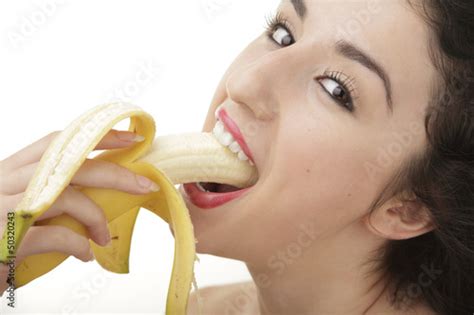 Beautiful Sexy Woman Eating Banana On White Background Stock Photo