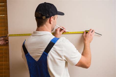Construction Worker Using Measuring Tape Stock Photo Image Of Person