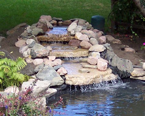A backyard waterfall can be a stunning or even therapeutic addition to your home. Build a Backyard Pond and Waterfall | Home Design, Garden ...