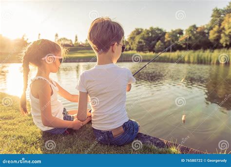 Kids Catching Fish Stock Photo Image Of Outdoors Leisure 76580722