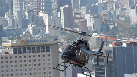 Helicóptero Volando A Unos Metros De Torre Latino Visto Desde El