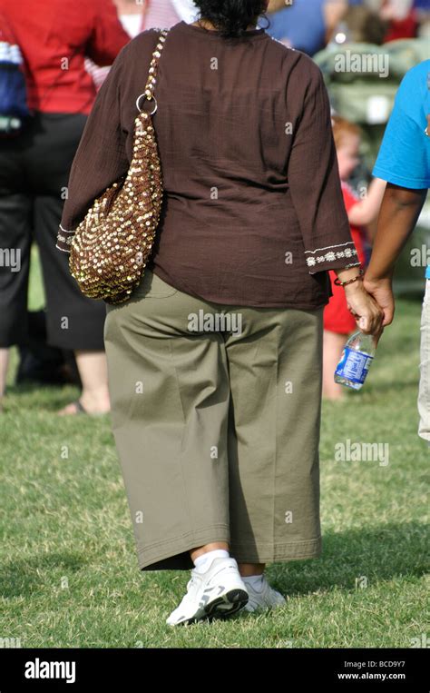 Fat Woman Obesity Obese Overweight Walking Rear Back View Hi Res Stock