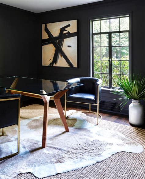 Layered Natural Fiber Rug With A Cowhide Rug Over It Black Painted