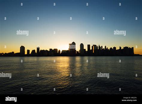 Lower Manhattan Skyline At Dawn Across The Hudson River New York City