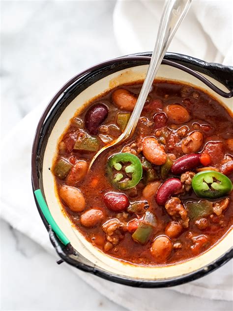 Make the ultimate spinach dip by adding ground sausage, pinto beans, cream cheese,and parmesan. Killer Beef and Three Bean Chili | foodiecrush.com