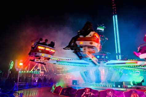 a colorful fair ride at night with motion blur editorial stock image image of lincolnshire