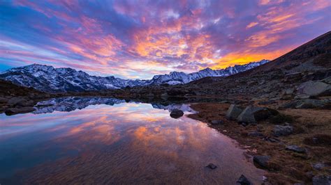 Alpine Lake In Italian Alps Colorful Sky Sunset Snow Mountain Range Landscape Reflection Photo