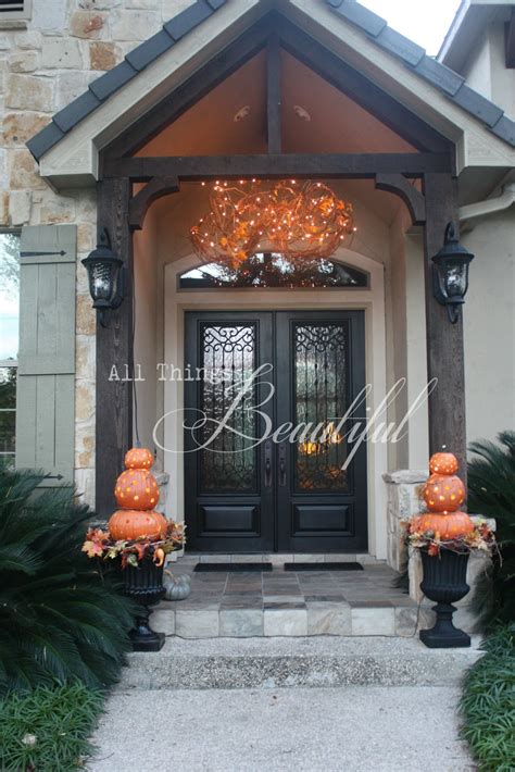 Add curb appeal, create a unified look and increase safety and security by installing outdoor porch lights near doorways, patios and walkways. All Things Beautiful: Fall Porch {Lighting}