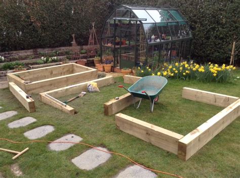 How to build raised beds using wooden railway sleepers for herbs etc. New pine railway sleeper raised beds