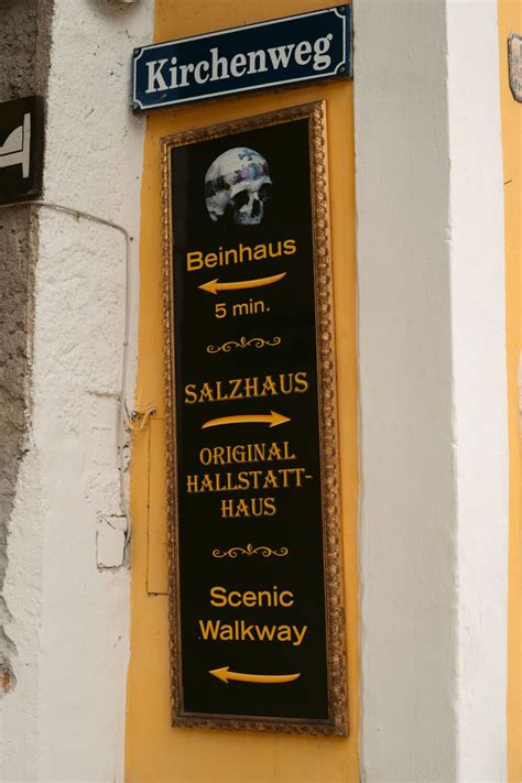 A Sign Pointing Visitors Towards The Beinahus In Hallstatt Austria