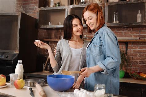 Positive Delighted Lesbians While Cooking Stock Image Image Of Milk