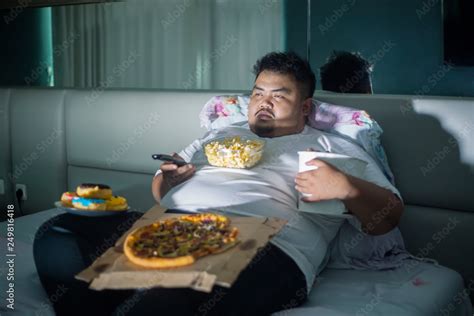 Asian Obese Man Eating Junk Foods Before Sleep Stock Photo Adobe Stock