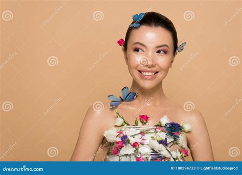 attractive smiling naked asian girl in flowers with butterflies on body stock image image of