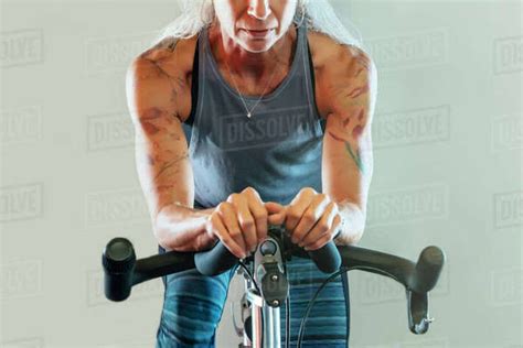 Woman Riding Stationary Bicycle Stock Photo Dissolve