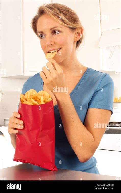 Girl Eating Potato Chips Or Crisps Stock Photo 9144698 Alamy