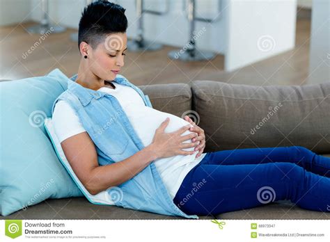 Pregnant Woman Relaxing On Sofa Stock Image Image Of Expecting Abode 66973347