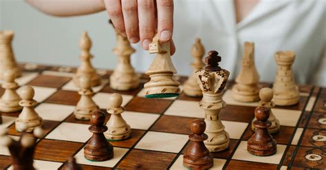 Person Playing Chess Game On Chess Board · Free Stock Photo