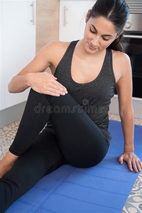 Woman Crossing Her Leg Over Her Knee In Exercise Stock Image Image Of