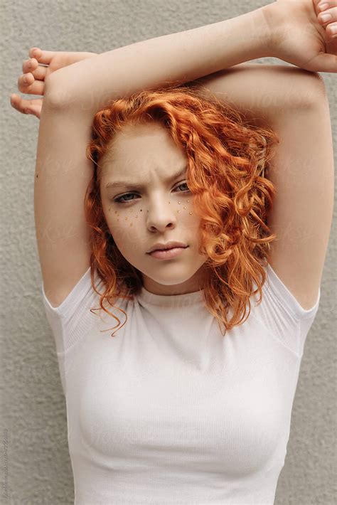A Curly Red Hair Girl With Fake Freckles Near The Wall By Stocksy Contributor Julie Meme