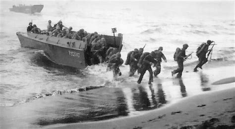 [photo] men of us 3rd marine division disembarking onto the invasion beach at bougainville