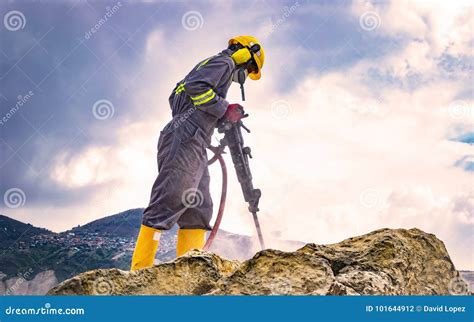 Worker On Top Of A Rock Stock Photo Image Of Hard Machine 101644912