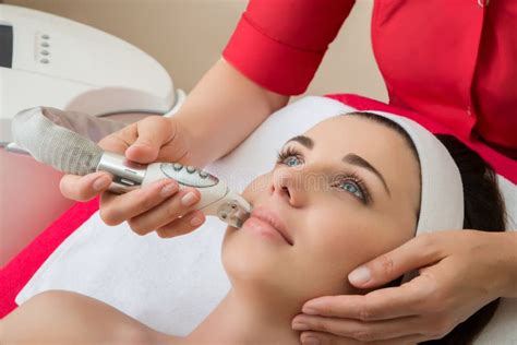 Rejuvenating Facial Treatment Model Getting Lifting Therapy Massage In A Beauty Spa Salon Stock