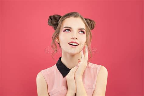 Portrait Of Beautiful Model Woman With Fashion Makeup On Bright Pink