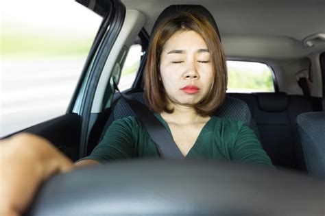 Premium Photo Tired Asian Woman Fall Sleeping While Driving The Car