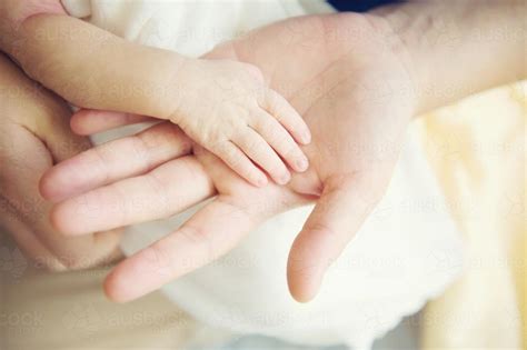 Image Of Adult Hand With Baby Hand Austockphoto