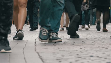 Low Angle Camera Angle Showing Lower Legs Of Crowd Of