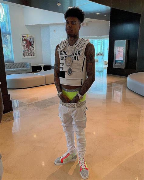 Blueface In A White Studded Vest Lv Belt And Louboutin Studded Sneakers