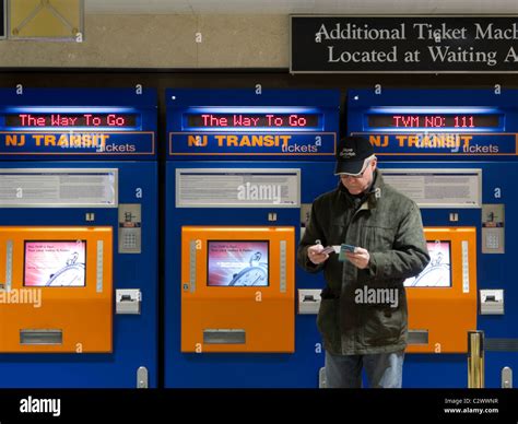 Man Purchasing New Jersey Transit Train Tickets At Self Serve Vending