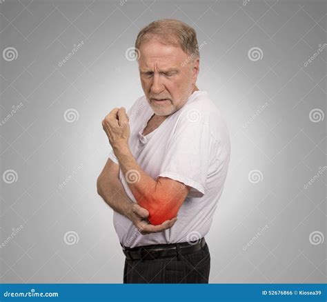 Senior Man With Red Elbow Inflammation Suffering From Pain Stock Photo