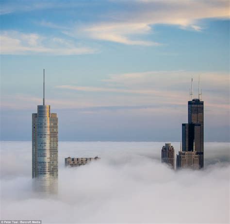 Stunning Images Of Chicago Skyscrapers Piercing Through Clouds As City
