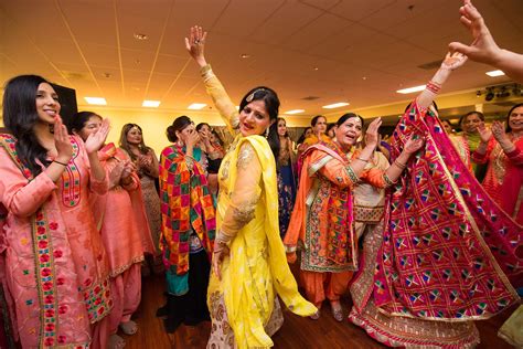 dancing at the sangeet part of an indian wedding photo by wedding