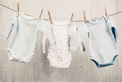 Baby Clothes Hanging On The Clothesline Stock Photo Download Image