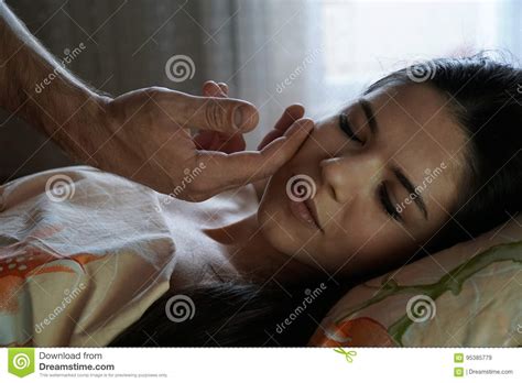 A Man S Hand Caresses The Girl S Face In The Morning The Girl Is