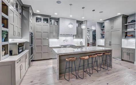 Contemporary Kitchen With Light Gray Cabinets Light Wood Floors And