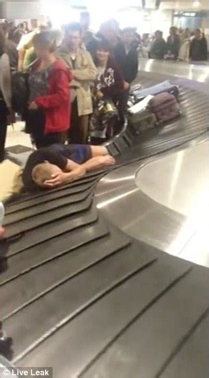 Tourist In Russia Takes A Nap On The Airport Baggage Reclaim Machine Daily Mail Online
