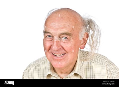 An Elderly Man Displaying His Comb Over To Cover His Balding Head