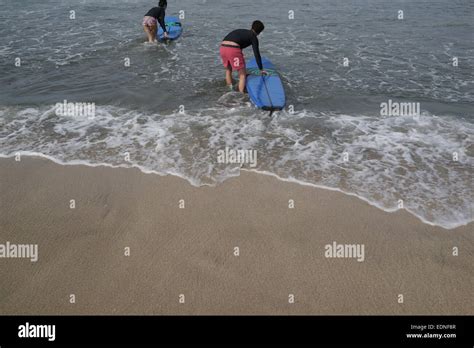 Tourists Surfing In Kuta Beach Bali Indonesia Kuta Is One Of The Most